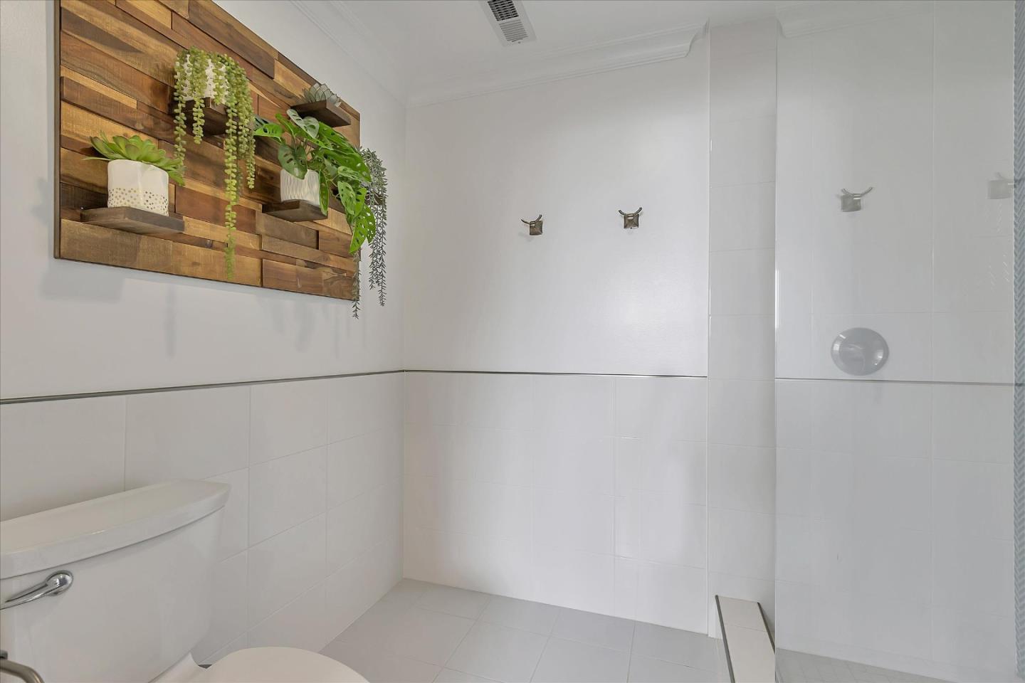 1261 Oddstad Boulevard Pacifica, CA 94044 - Photo 45 of 62 a bathroom with a shower and a toilet