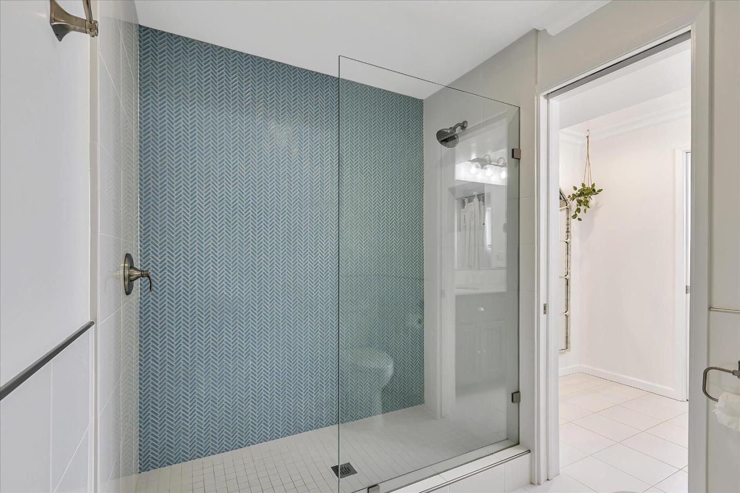 1261 Oddstad Boulevard Pacifica, CA 94044 - Photo 46 of 62 a bathroom with a glass shower door