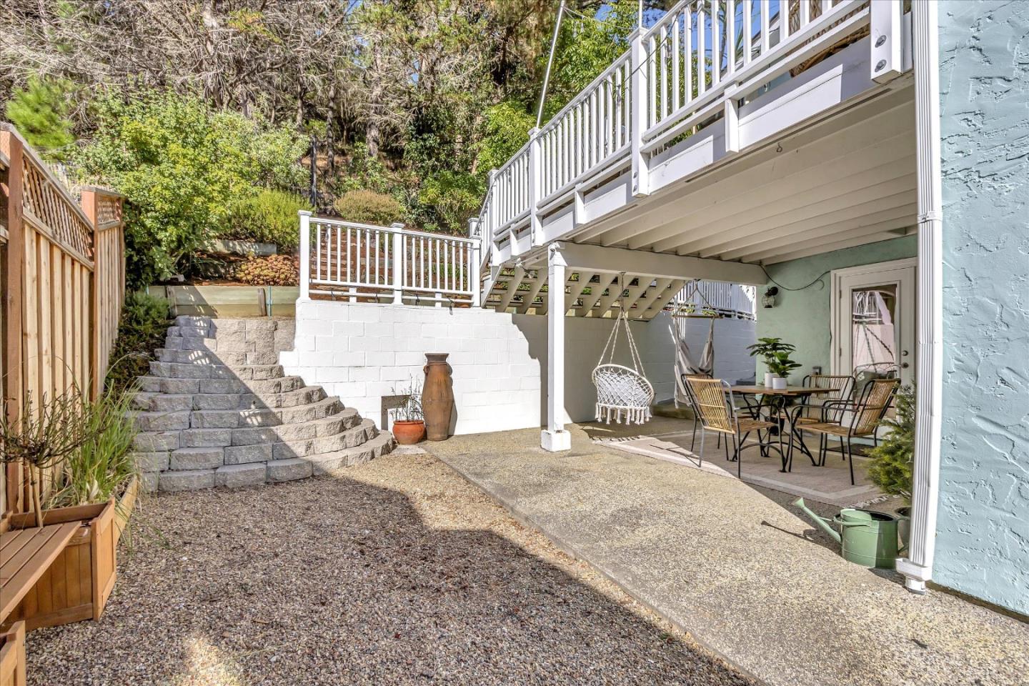 1261 Oddstad Boulevard Pacifica, CA 94044 - Photo 55 of 62 a view of house with patio outdoor seating and covered with trees