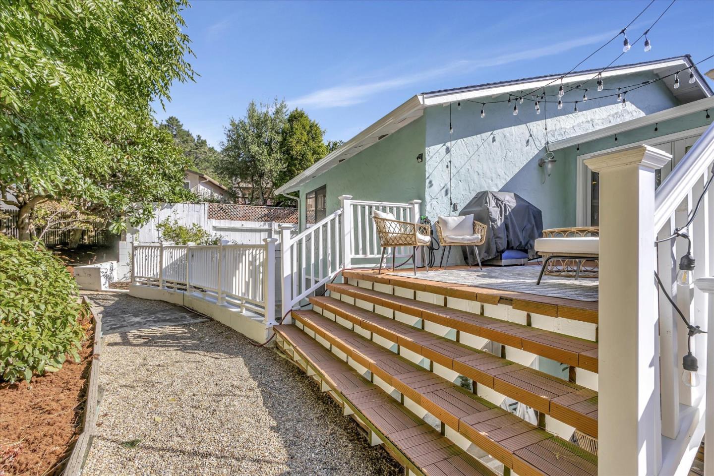 1261 Oddstad Boulevard Pacifica, CA 94044 - Photo 57 of 62 a view of a porch with furniture and a small yard