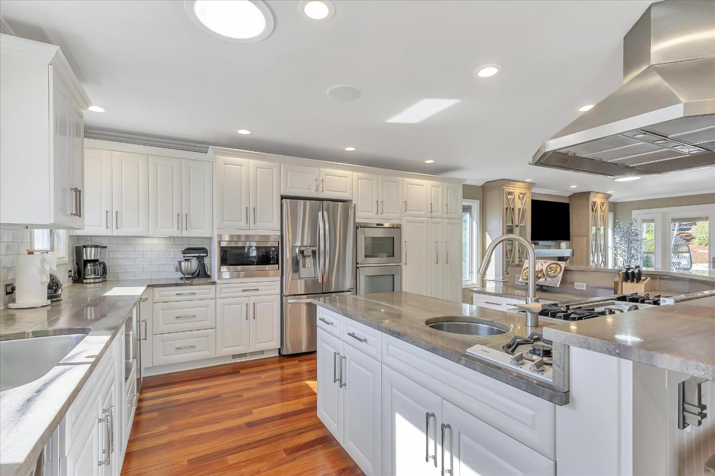 1261 Oddstad Boulevard Pacifica, CA 94044 - Photo 8 of 62 a kitchen with stainless steel appliances granite countertop a sink stove and refrigerator