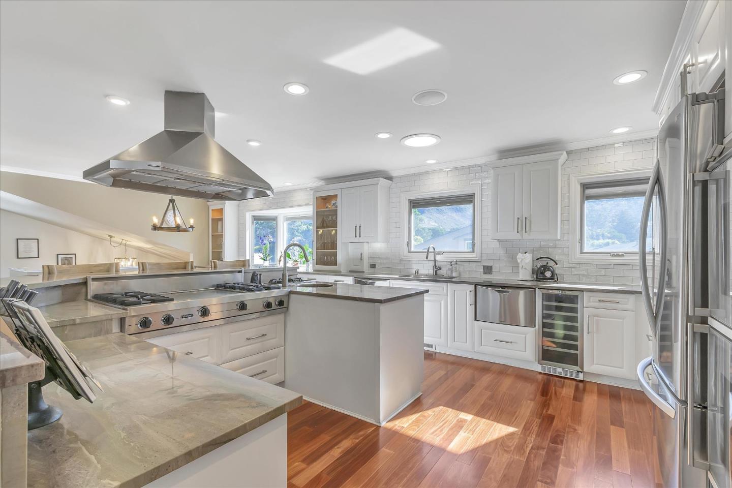 1261 Oddstad Boulevard Pacifica, CA 94044 - Photo 9 of 62 a kitchen with stainless steel appliances granite countertop a stove and a refrigerator