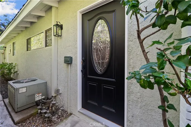a bathroom with a tub a sink and a large mirror