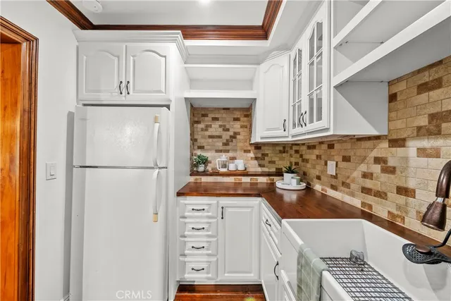 a kitchen with stainless steel appliances granite countertop a sink and cabinets
