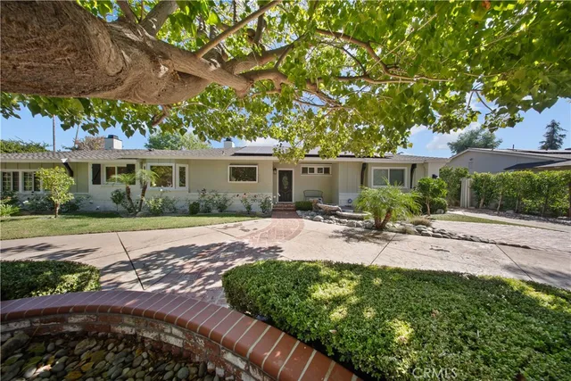 a view of a swimming pool with a yard
