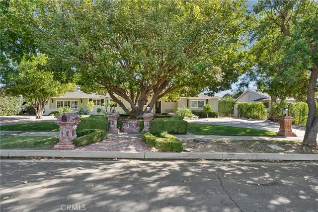 a view of a house with swimming pool and sitting area
