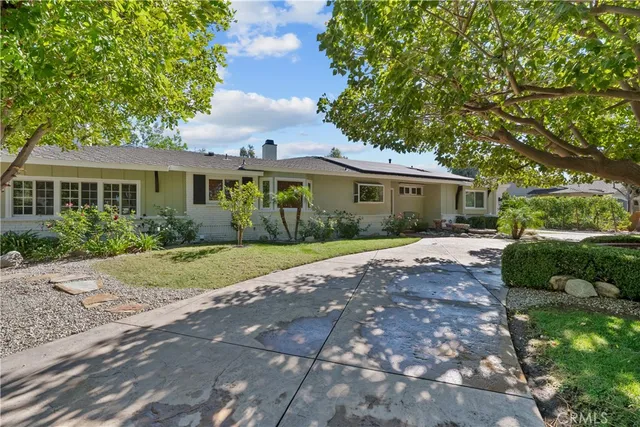 a swimming pool view with a outdoor seating