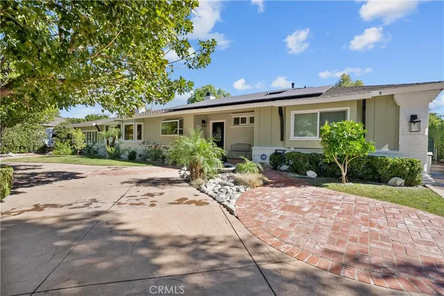 a view of a room with wooden floors