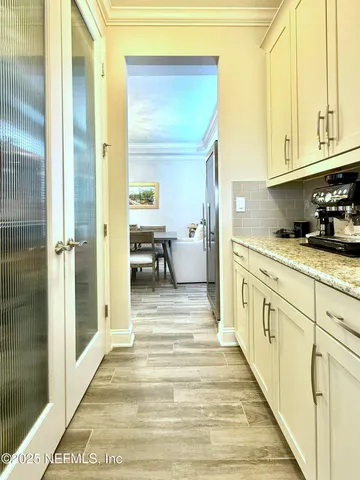 a view of a kitchen from the hallway