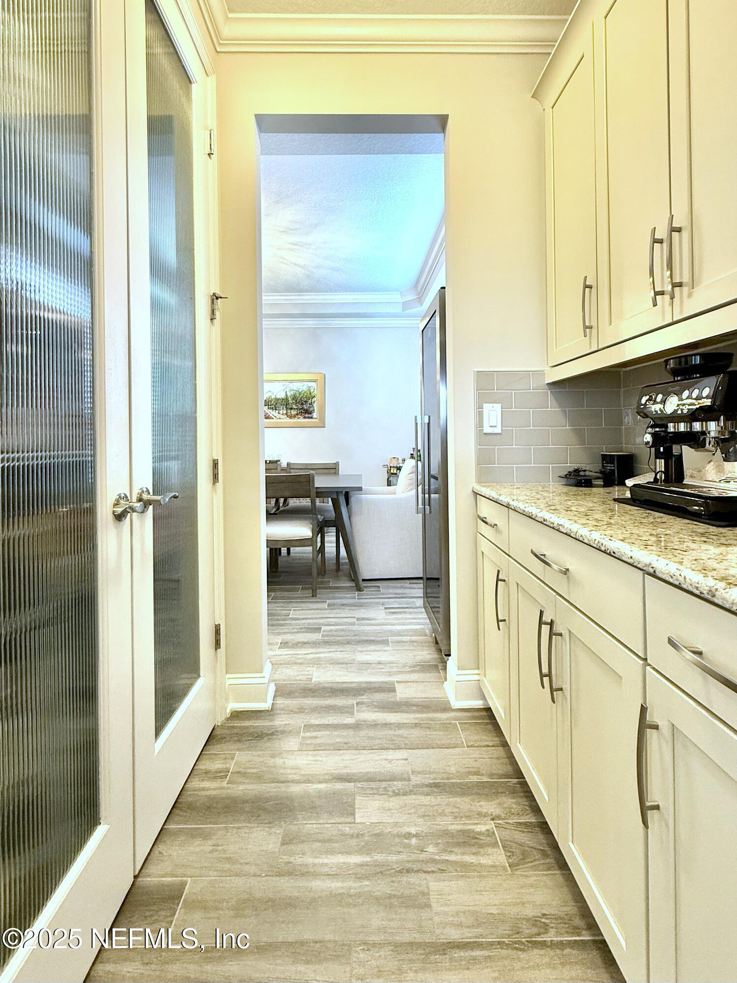 6887 Azalea Grove Drive Jacksonville, FL 32258 - Photo 11 of 35 a view of a kitchen from the hallway