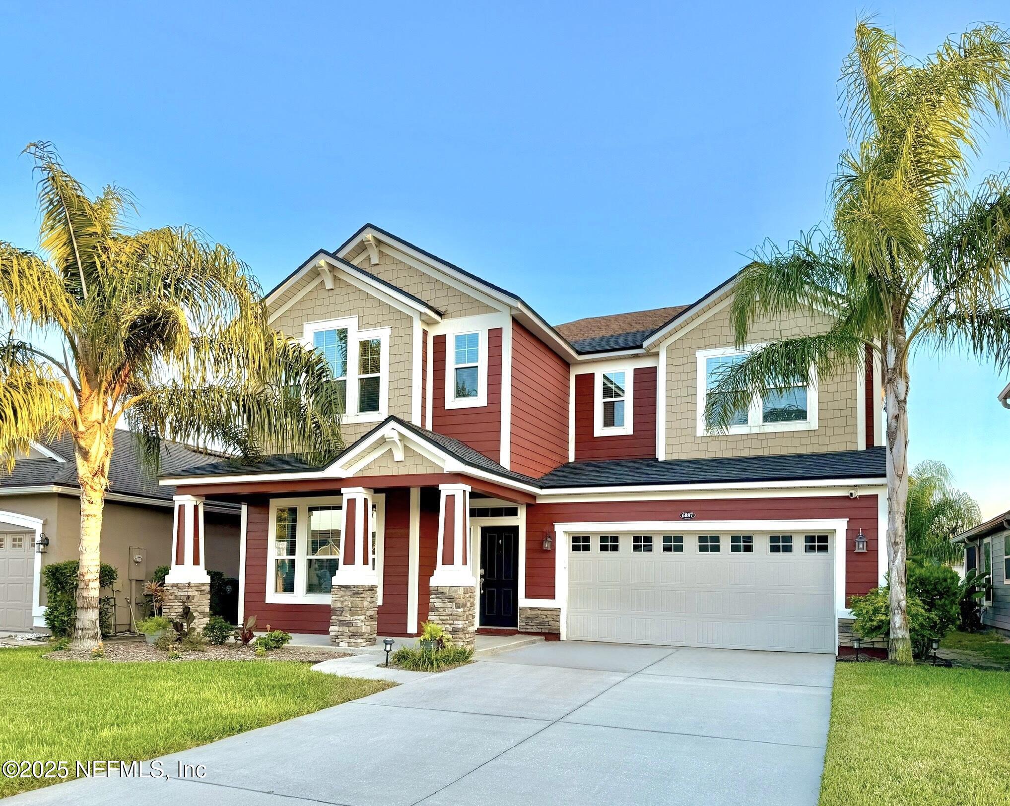 6887 Azalea Grove Drive Jacksonville, FL 32258 - Photo 2 of 35 a front view of a house with a yard