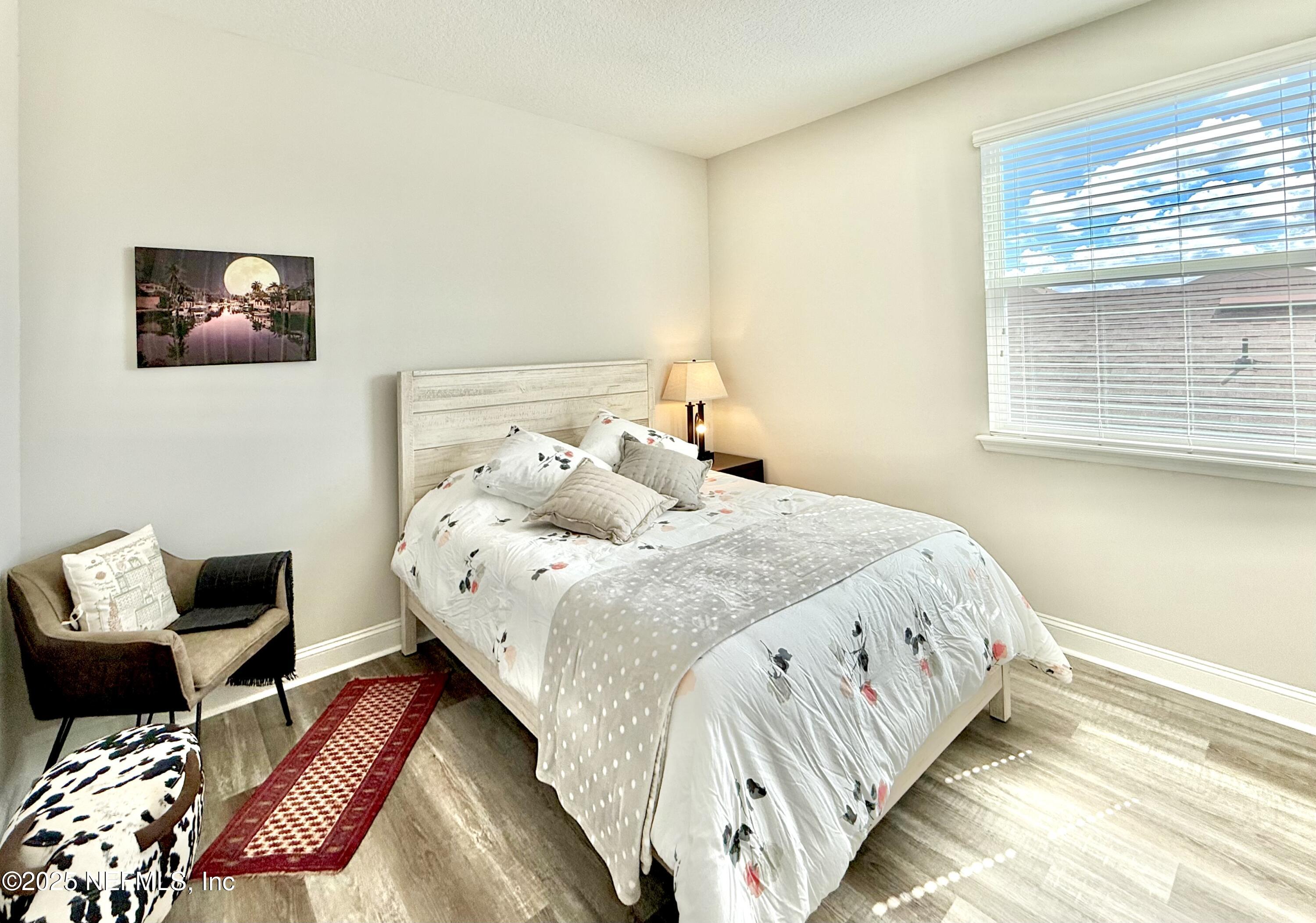 6887 Azalea Grove Drive Jacksonville, FL 32258 - Photo 26 of 35 a bedroom with bed and a window