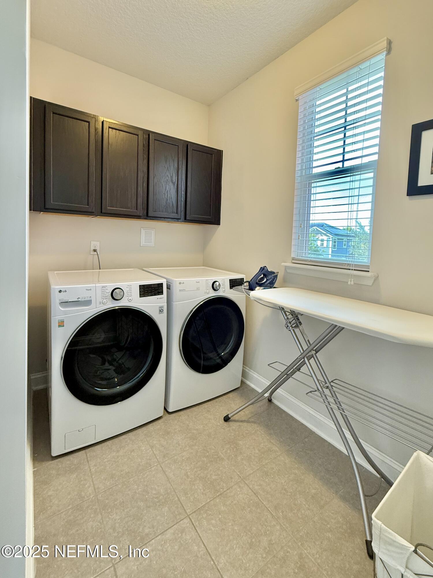 6887 Azalea Grove Drive Jacksonville, FL 32258 - Photo 28 of 35 a utility room with dryer and washer