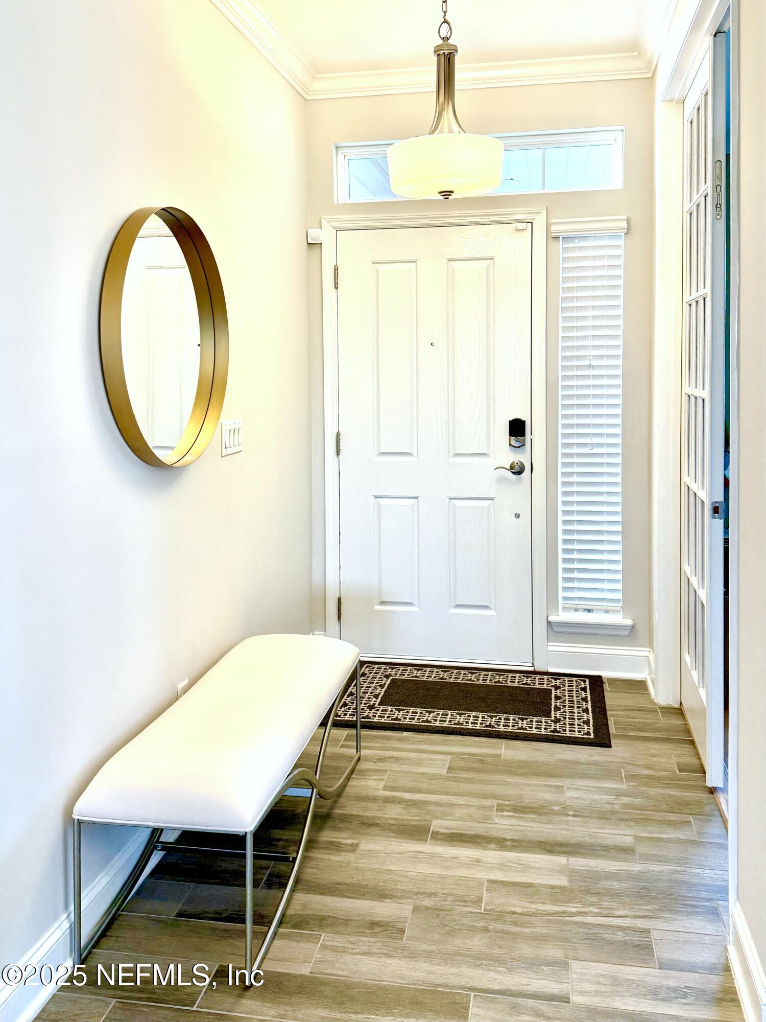 6887 Azalea Grove Drive Jacksonville, FL 32258 - Photo 3 of 35 a view of a room with a table and chair