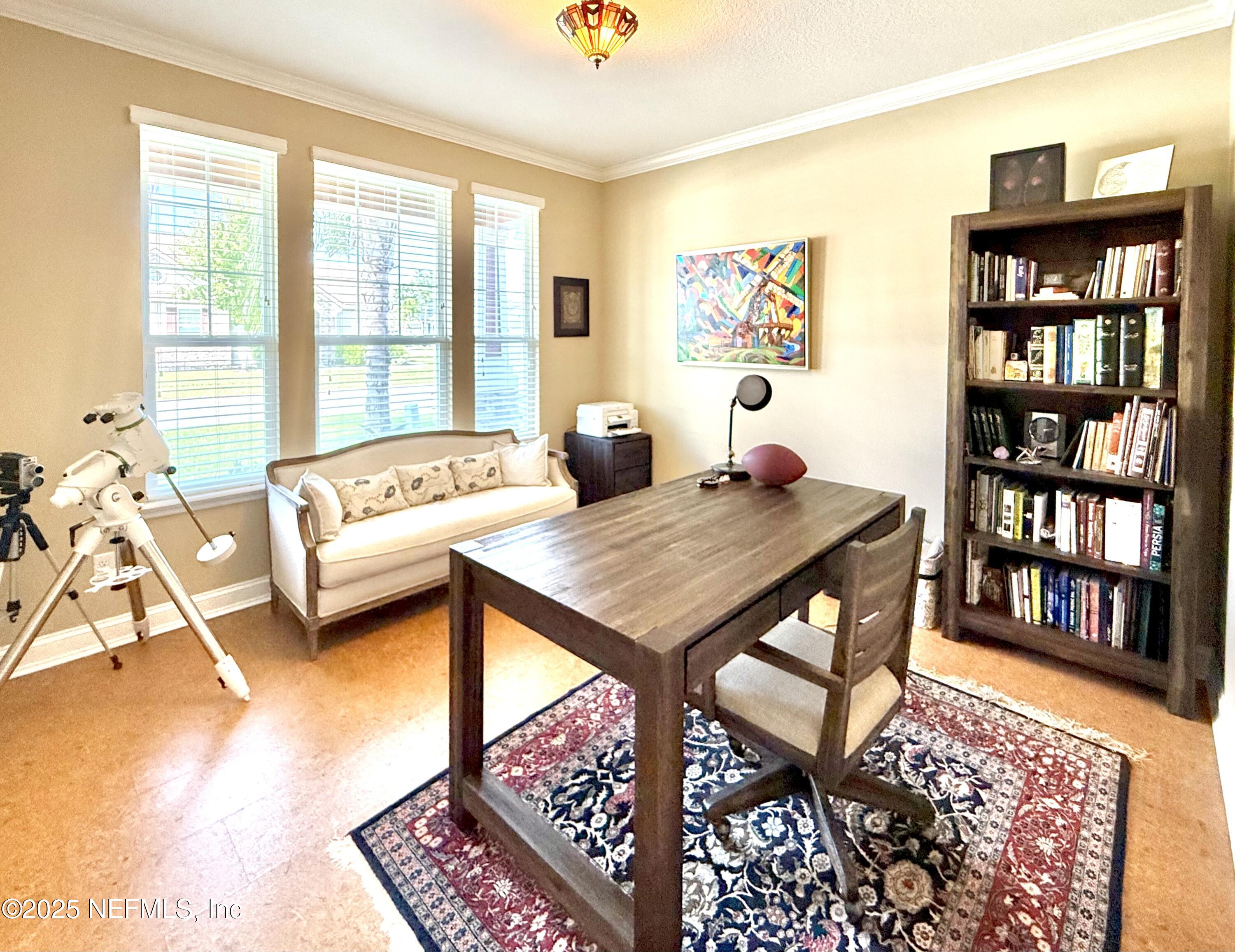 6887 Azalea Grove Drive Jacksonville, FL 32258 - Photo 5 of 35 a living room with furniture a rug and a table