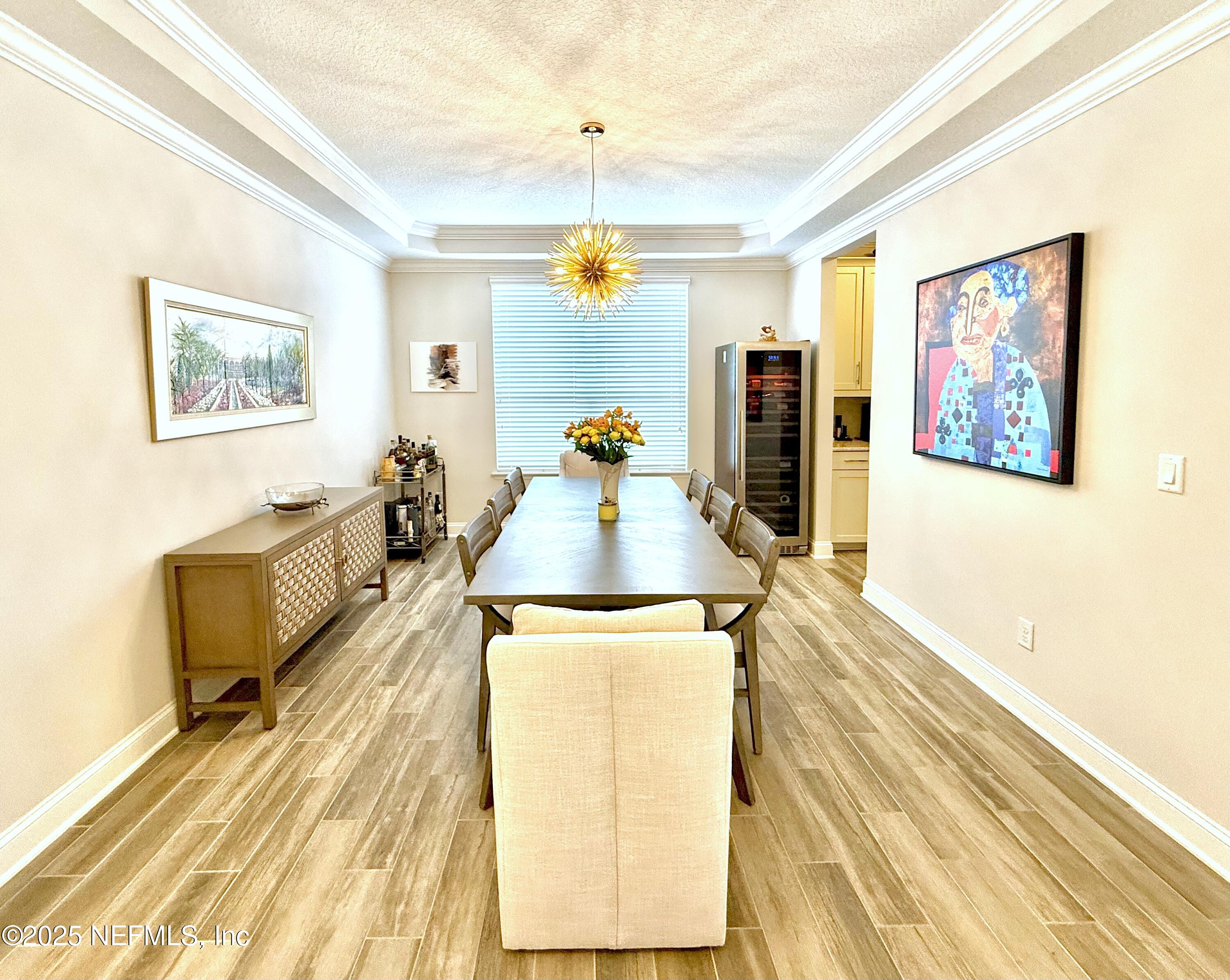 6887 Azalea Grove Drive Jacksonville, FL 32258 - Photo 7 of 35 a living room with furniture and a wooden floor