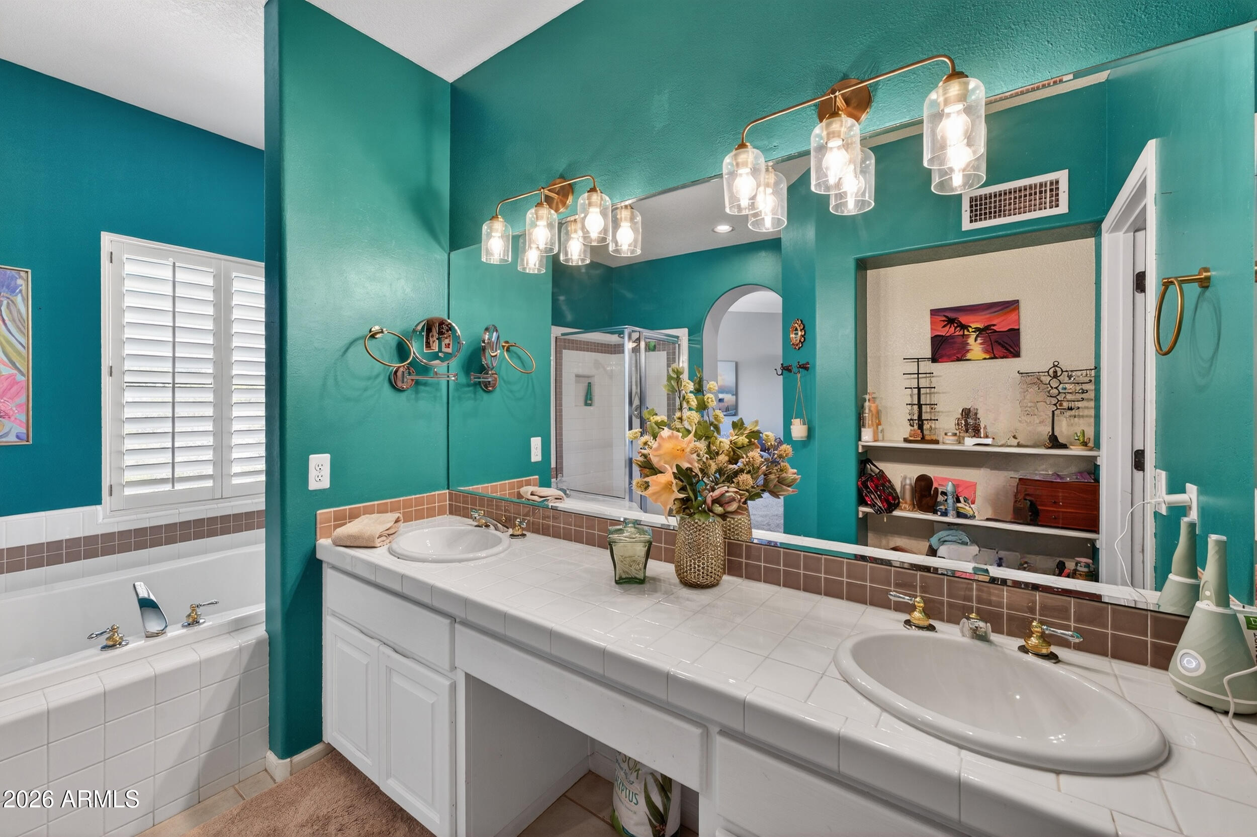 1539 East Winged Foot Road Phoenix, AZ 85022 - Photo 37 of 64 a bathroom with a sink mirror and vanity