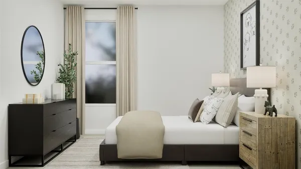 a bedroom with a bed and a mirror