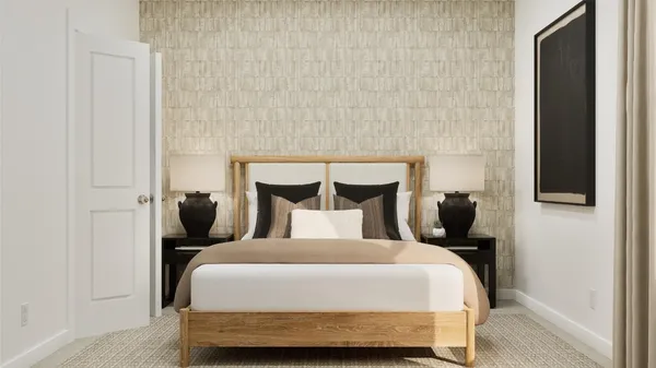 a bedroom with a bed and a night stand