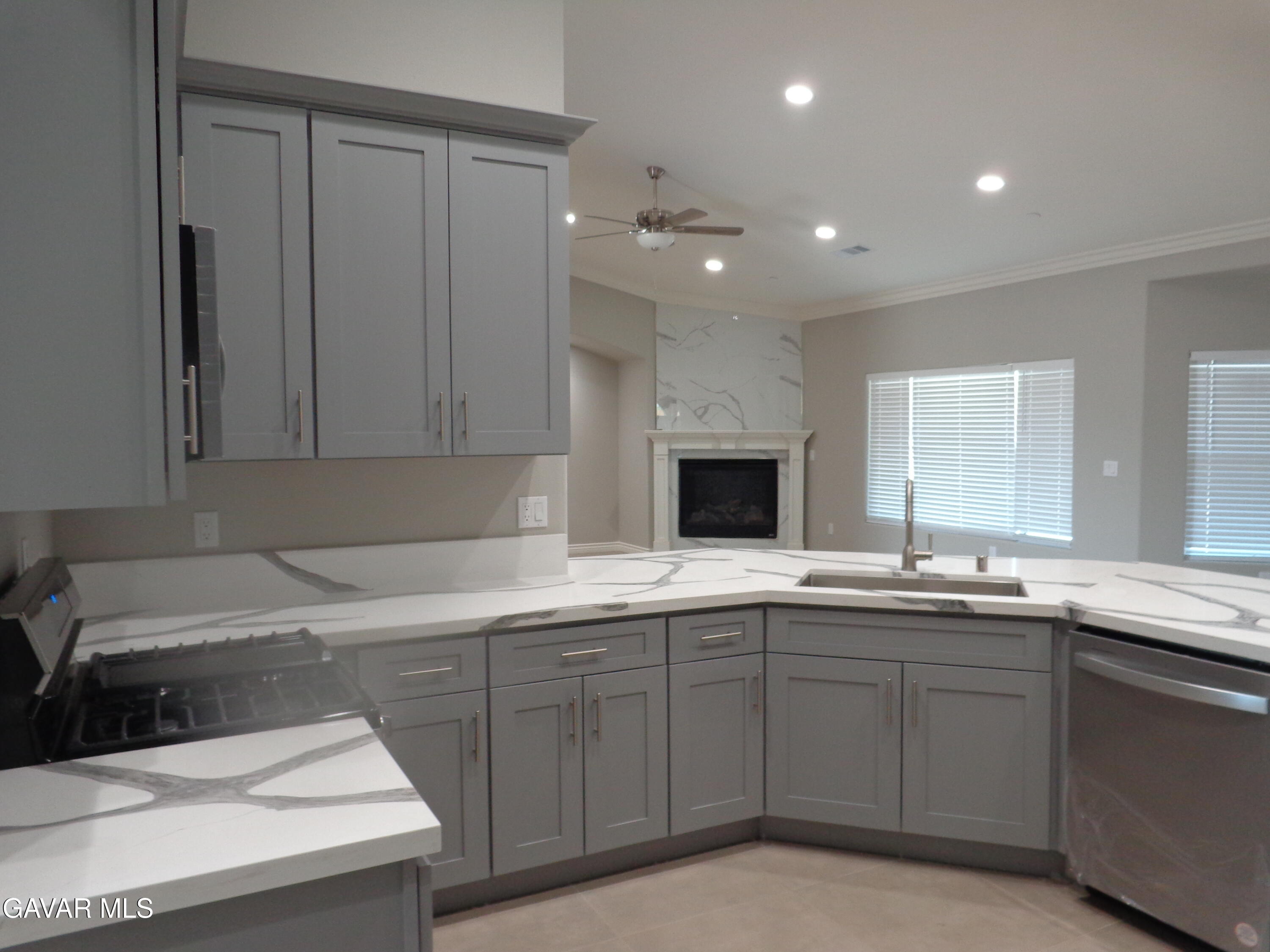 18255 Winnetka Road Apple Valley, CA 92307 - Photo 11 of 33 a kitchen with a sink and cabinets