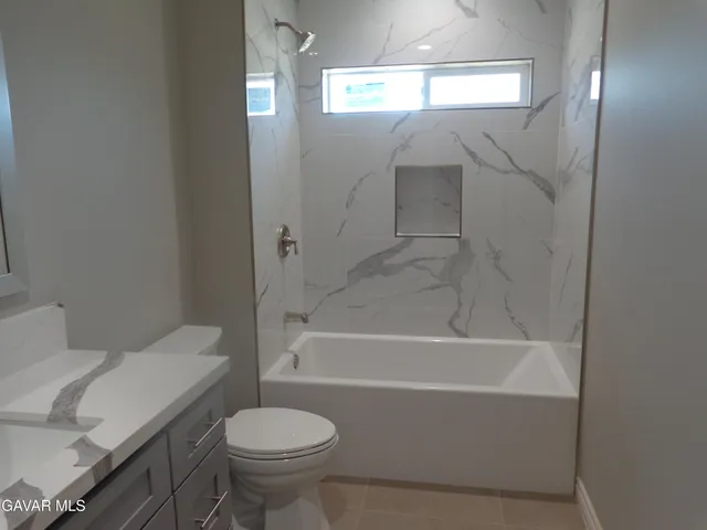 a bathroom with a sink and toilet