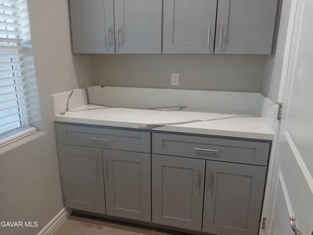 a utility room with cabinets