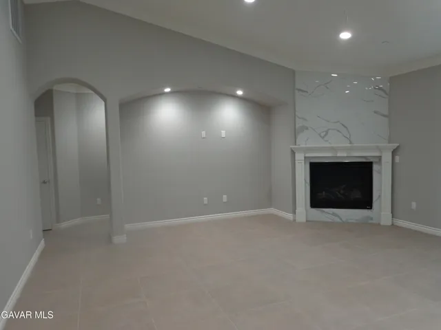 an empty room with a fireplace