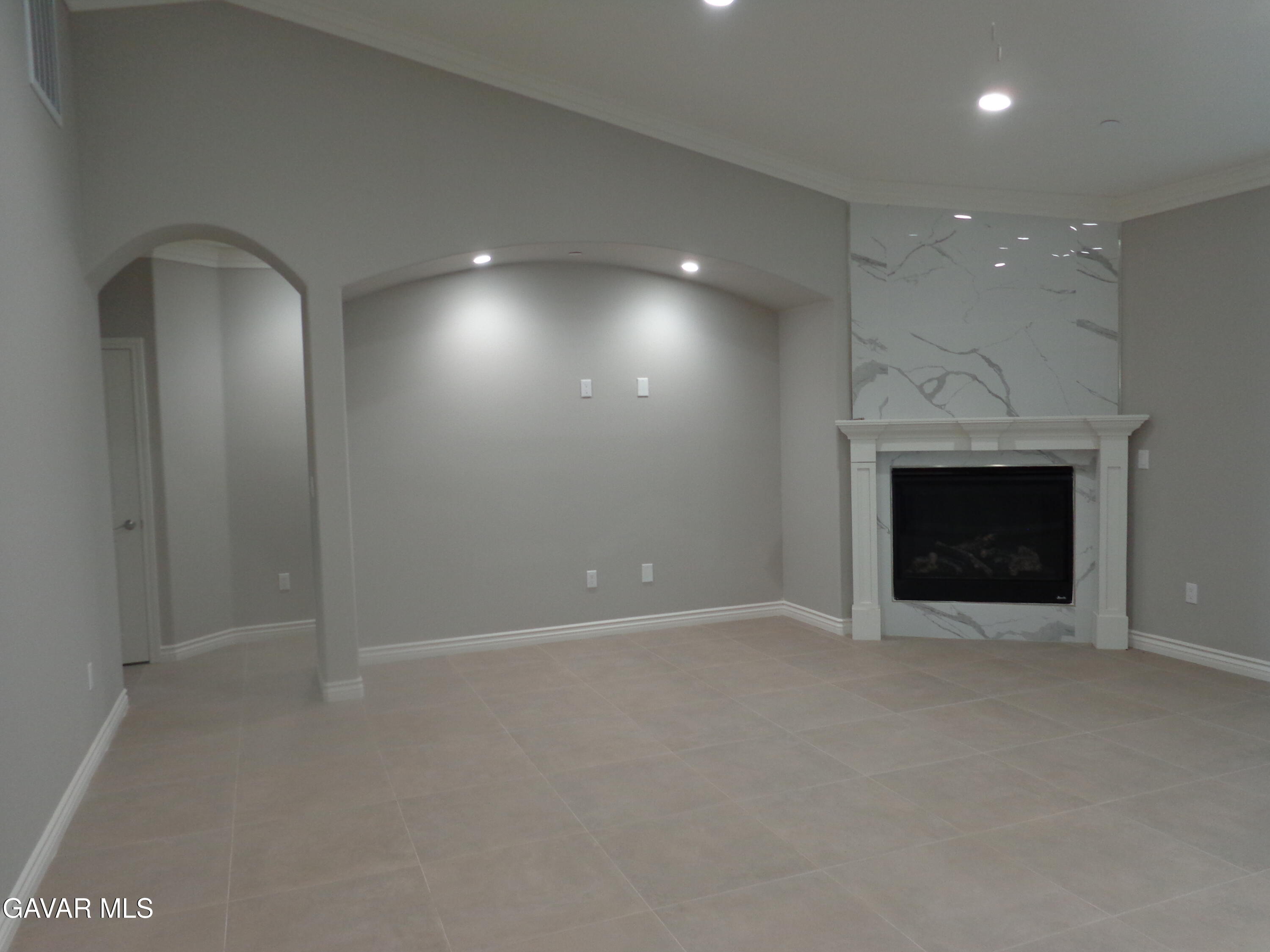 18255 Winnetka Road Apple Valley, CA 92307 - Photo 5 of 33 an empty room with a fireplace