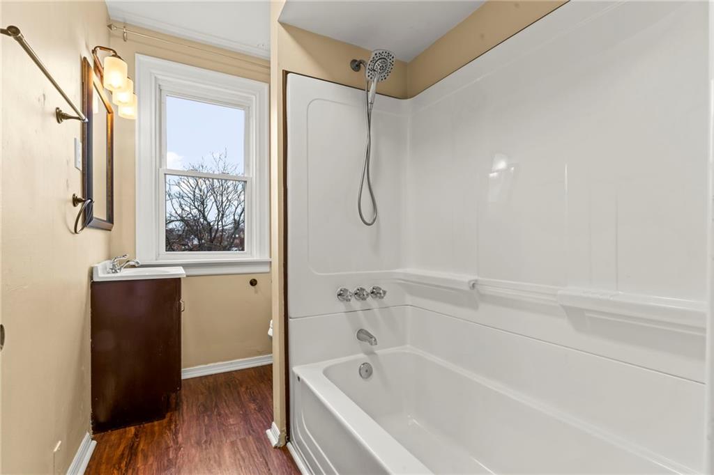 3350 Webster Avenue Pittsburgh, PA 15219 - Photo 15 of 23 a bathroom with a bathtub and a shower