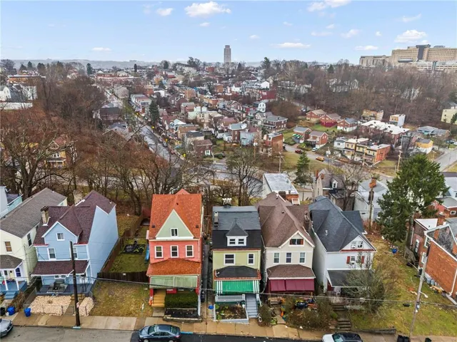 an aerial view of residential houses and street