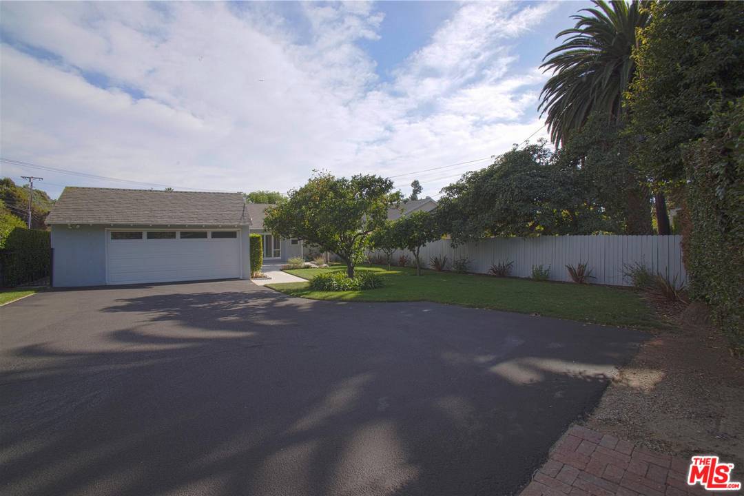 12101 Sunset Boulevard Los Angeles, CA 90049 - Photo 13 of 15 a view of a yard with palm trees