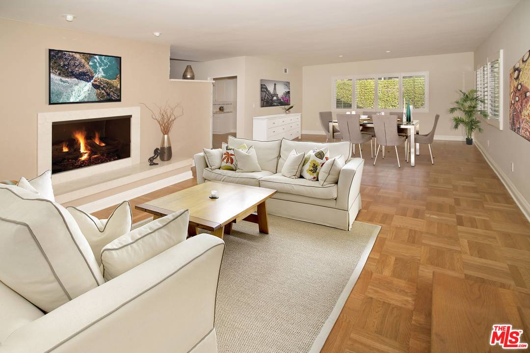12101 Sunset Boulevard Los Angeles, CA 90049 - Photo 2 of 15 a living room with furniture and a fireplace