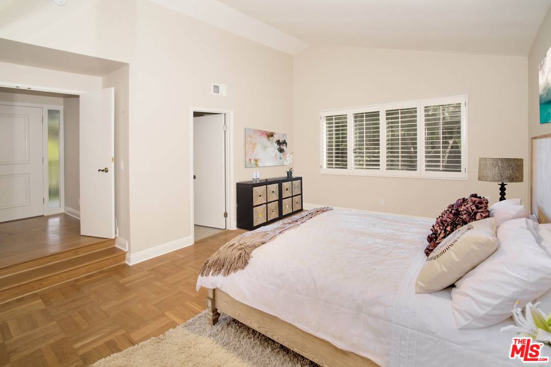 12101 Sunset Boulevard Los Angeles, CA 90049 - Photo 6 of 15 a bedroom with a bed and a window