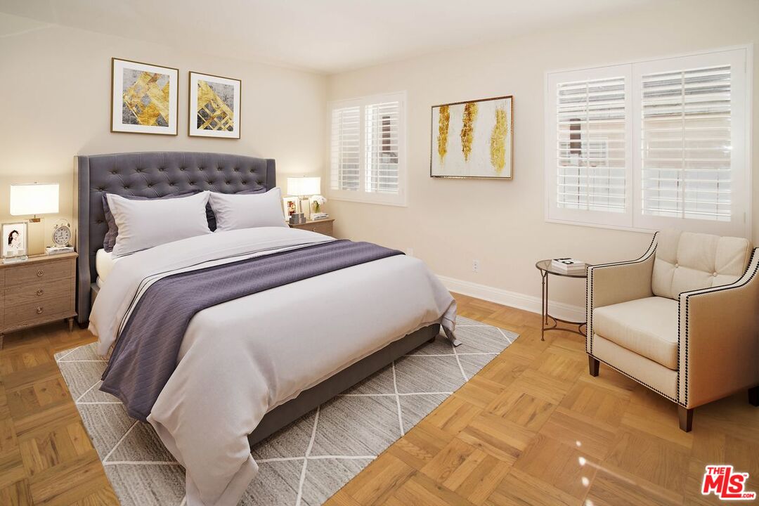 12101 Sunset Boulevard Los Angeles, CA 90049 - Photo 9 of 15 a spacious bedroom with a bed and a couch