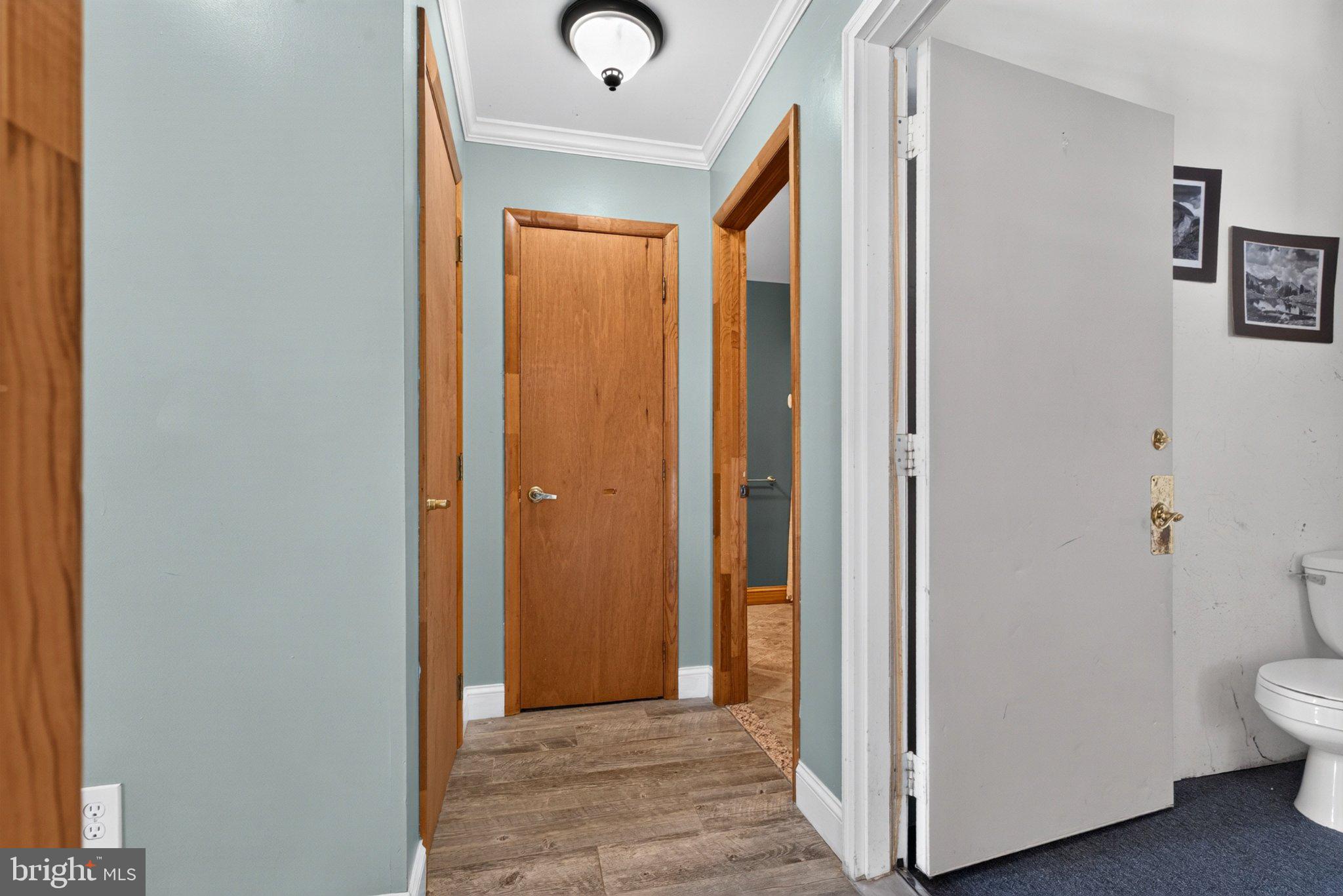 2858 Lodge Farm Road Baltimore, MD 21219 - Photo 21 of 49 Inviting hallway with warm wood accents.