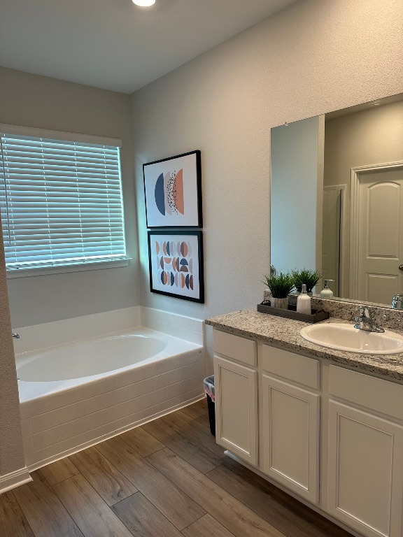 105 McLintock Road Jarrell, TX 76537 - Photo 10 of 10 Primary bathroom includes vinyl plank flooring, granite countertops with a garden tub and separate shower.
Pictures, floor plans, features, and colors are approximate for illustration purposes only. Home pictured may display decorative items, furniture and enhanced interior paint which are not available for purchase even upon additional payment.