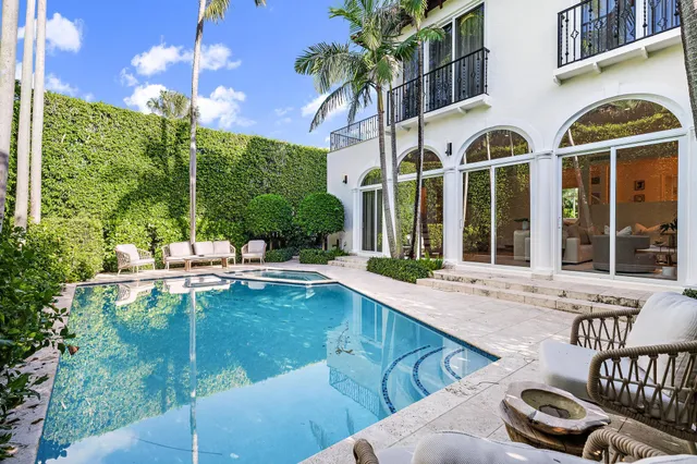 a view of a swimming pool with a lounge chairs