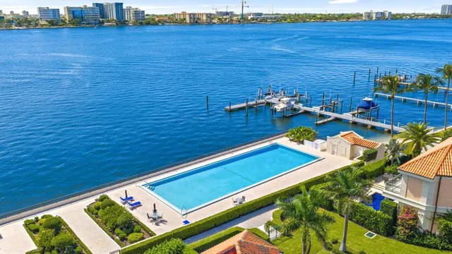 a view of a pool with outdoor seating