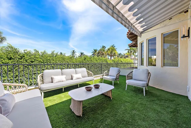 a bedroom with a large bed and a couch
