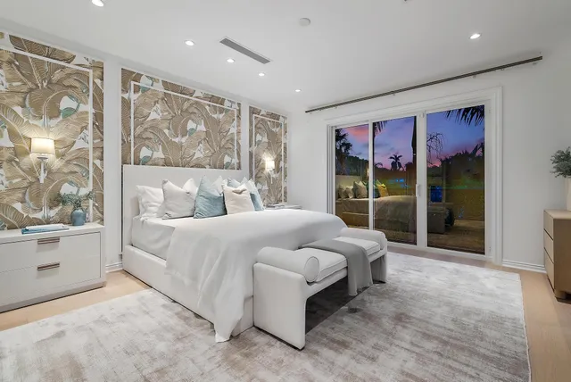 a spacious bathroom with a double vanity sink mirror and toilet