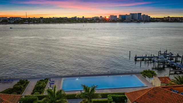 a bed room with a bed and a large window