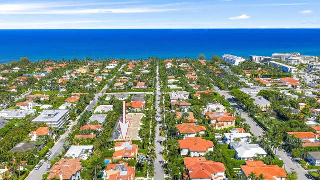 an aerial view of residential houses with outdoor space and river