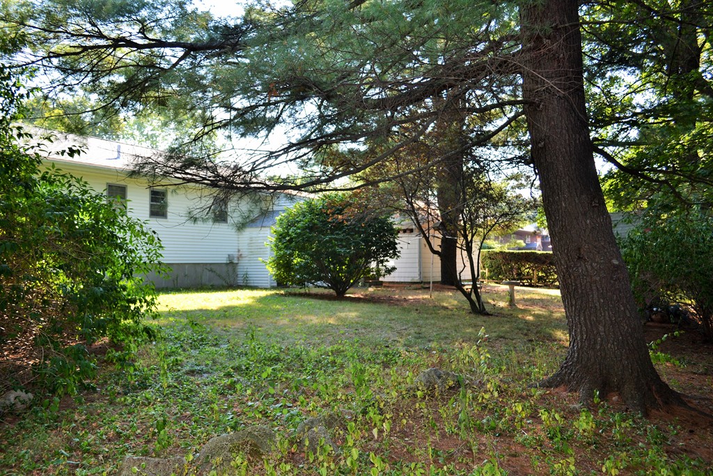 12 Scenna Road Beverly, MA 01915 - Photo 4 of 6 a backyard of a house with lots of green space