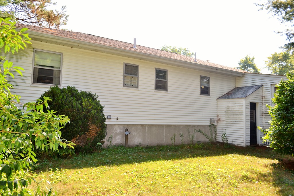 12 Scenna Road Beverly, MA 01915 - Photo 5 of 6 a view of a backyard with plants and a patio