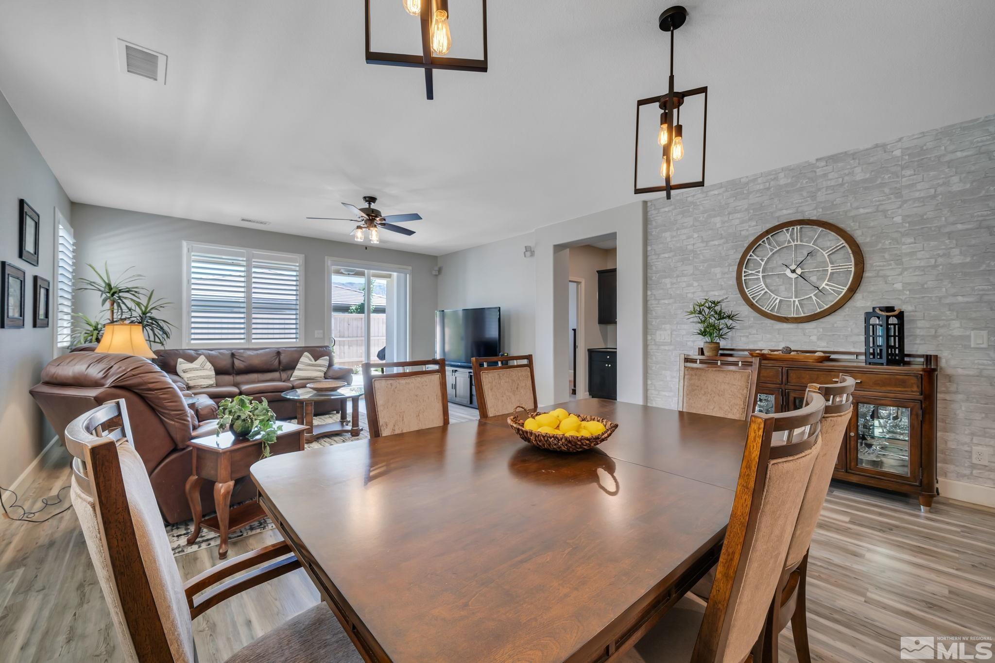 10128 Quintana Drive Reno, NV 89521 - Photo 11 of 34 a living room with furniture and a clock