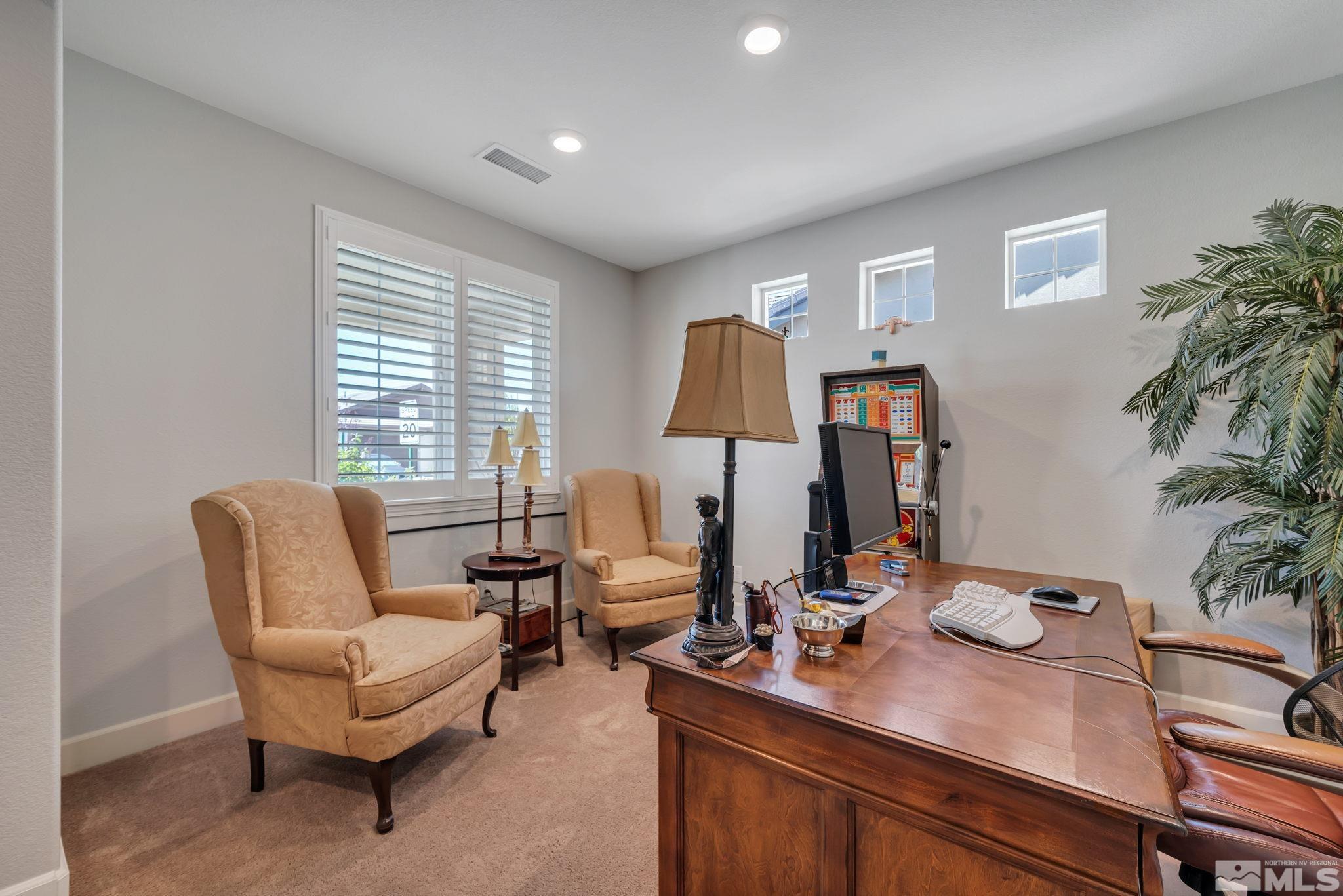 10128 Quintana Drive Reno, NV 89521 - Photo 20 of 34 a view of a workspace with furniture and a window