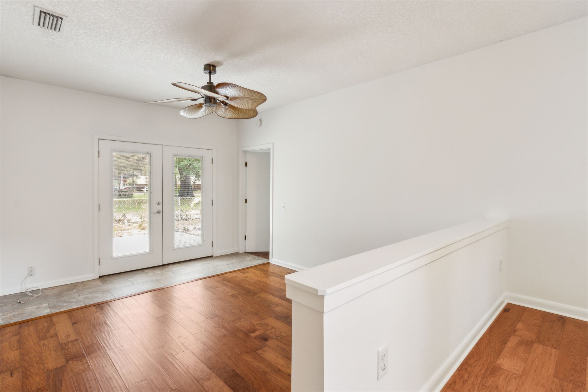 2441 Amelia Road Fernandina Beach, FL 32034 - Photo 22 of 36 an empty room with windows and fan