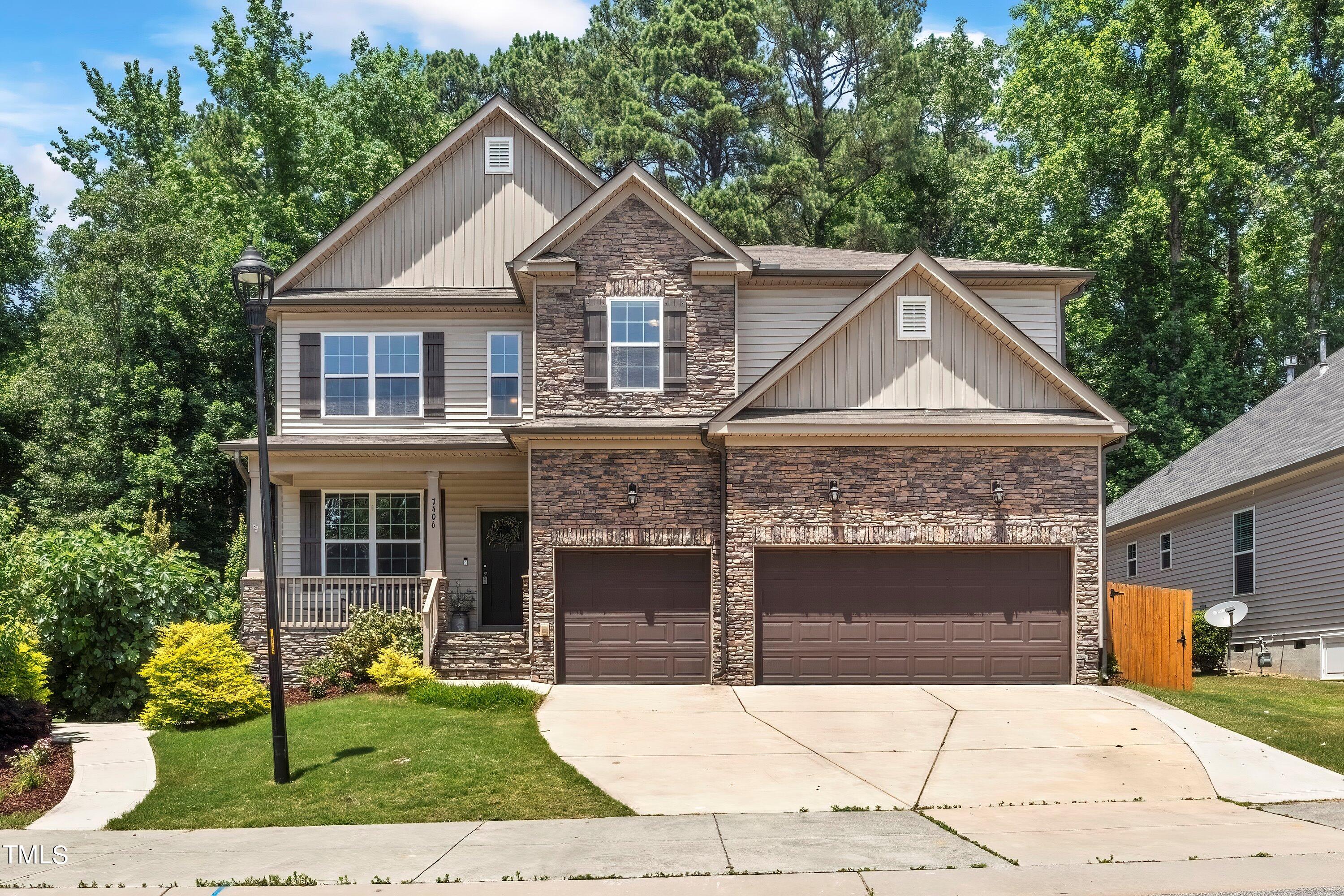 7406 Randshire Way Raleigh, NC 27616 - Photo 1 of 38 a front view of a house with yard