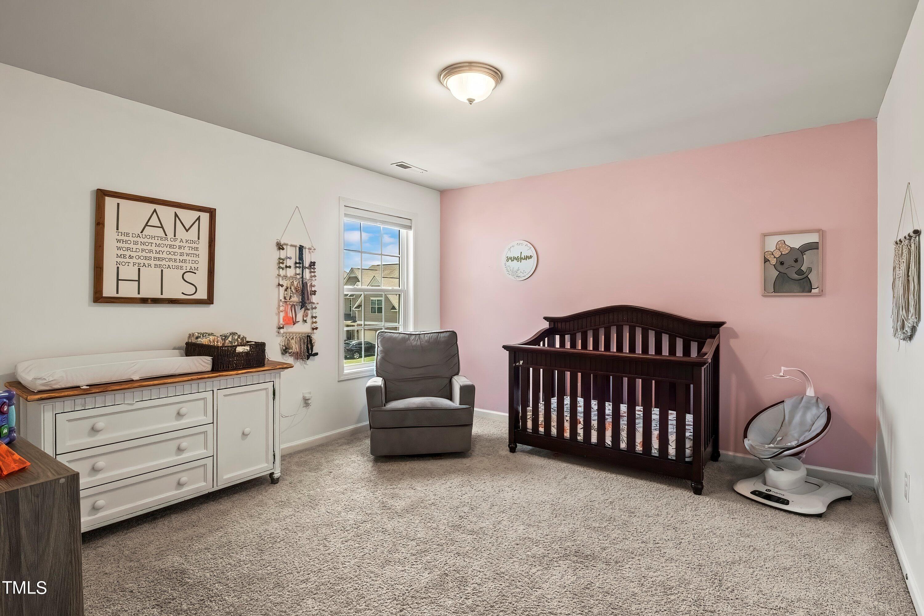 7406 Randshire Way Raleigh, NC 27616 - Photo 30 of 38 a bedroom with furniture and a window