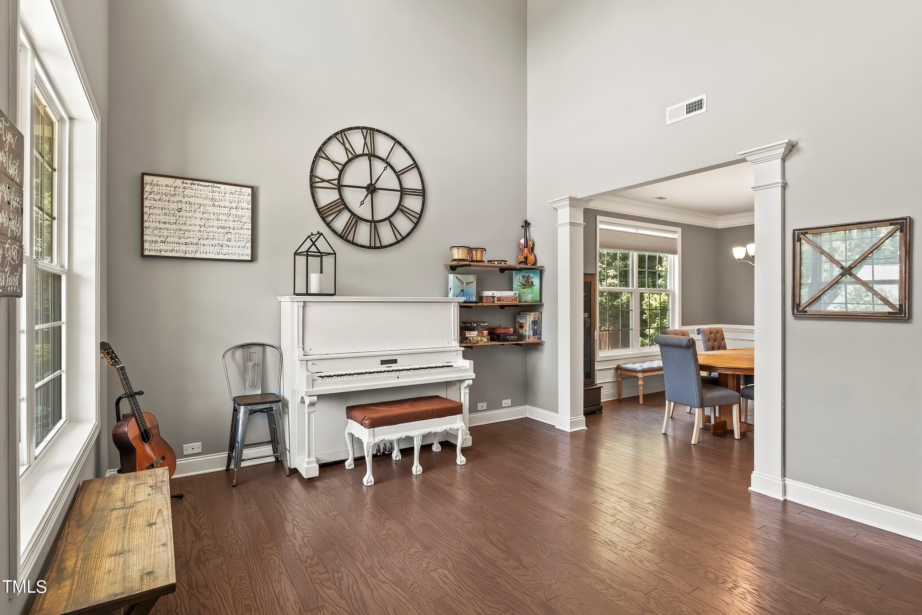 7406 Randshire Way Raleigh, NC 27616 - Photo 3 of 38 a living room with furniture and a wooden floor